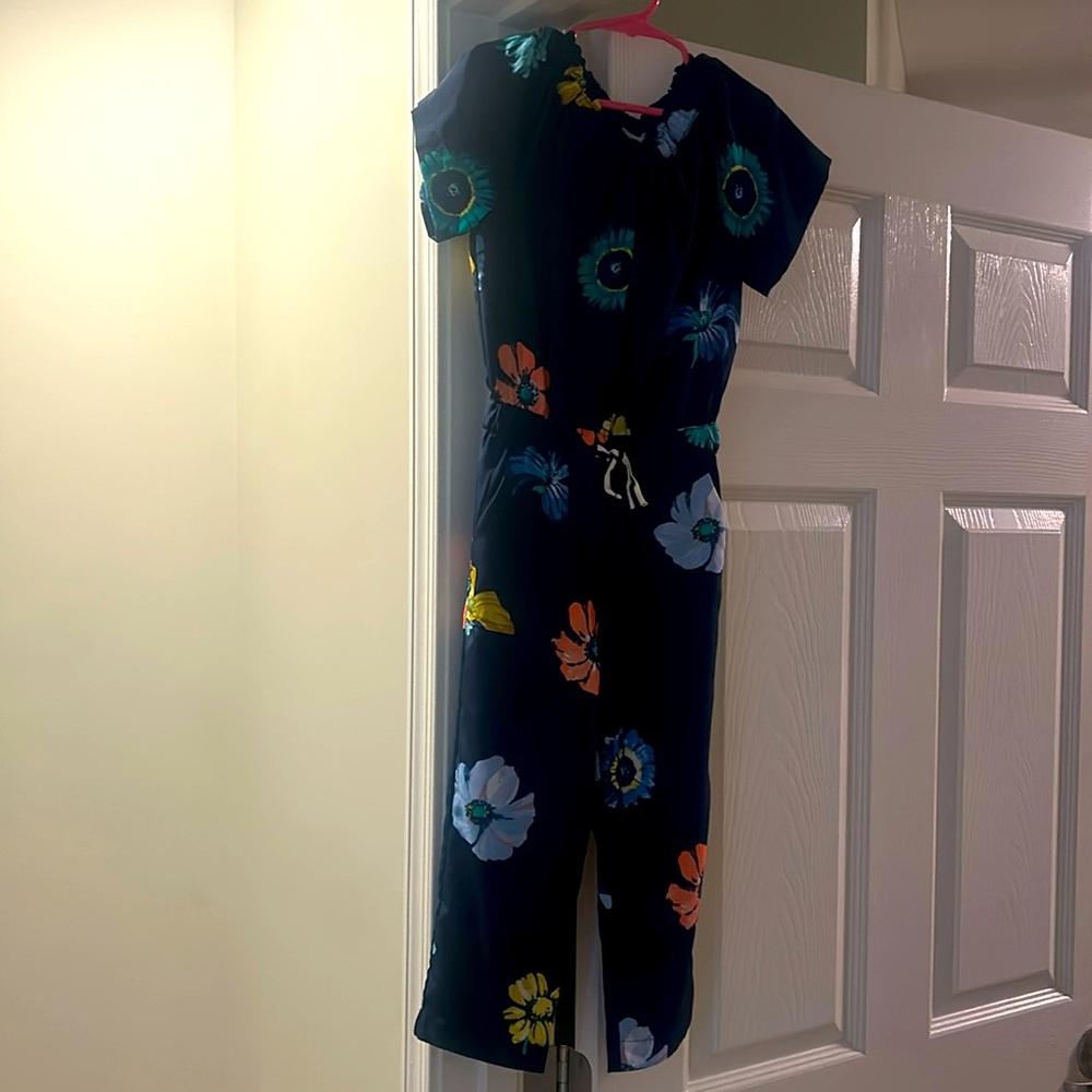 Off the shoulder navy flower print jumpsuit.